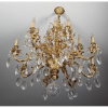 <p>Grande e elegante lustre de cristal Baccarat e Vermeil, com 16 luzes. Roseta superior trabalhada terminando em pinha com bola. Diâm. 92 x 130 cm alt. França, séc XIX/XX.</p>