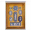 <p>WEDGEWOOD, Composição com 09 placas de biscui nas tonalidades azul e branco, ornamentados com figuras clássicas e mitológicas, emolduradas junto. 52 x 38cm. (total c/ moldura). Inglaterra, séc. XIX</p>