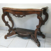 Console estilo pernambucano, do Séc. XIX, em jacarandá. Pernas em volutas. Platô inferior na forma de meia lua. Tampo de mármore. (mármore restaurado). Med. 86x110x48cm. 