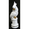 Cacatua de coleção, Art-deco, em porcelana alemã da Bavária, nas cores branca e dourada. Marca da manufatura na base. Alt. 35cm.