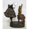 P. Terepzizuk - Escultura européia em bronze e biscuit com Pierrot, representando jovem com pierrot. Assinada. Alt. 19cm.