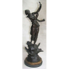 Escultura em bronze, representando Jovem tocando harpa, estando esta sobre rochas com pássaros em alto relevo. Base com 2 camadas de mármore, sendo uma de cada cor. (cordas da harpa não originais). Alt. total 62,5cm.