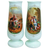 Belo par de vasos em opalina européia, na cor leitosa, decorados com pintura policromada em reserva de cenas de galanteio. Alt. 48cm.