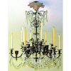 Antigo e belo lustre estilo Versailles, para 12 luzes em bronze e cristal. Apresenta 6 braços maiores e 6 menores, tendo cada um castiçal para 1 vela (uma bobeche colada). Alt. 104cm. 