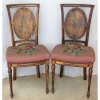 Antigo e belo par de cadeiras, estilo francês, Luís XVI, em madeira dourada e entalhada. Encosto com palhinha. Assento estofado e forrado em tecido bordado floral em policromia. Med. 92x45x39cm. 