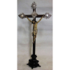 Crucifixo, do Séc. XIX, em jacarandá entalhado, com Cristo em madeira policromada. Adereços em metal espessurado a prata. Falta 1 cravo em uma mão e um no pé. Alt. crucifixo 67cm. Alt. Cristo 29cm. 
