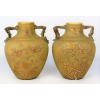 Belo par de vasos europeus, do séc. XIX, em pasta de vidro, com delicada pintura de pássaros e flores em dourado, com toques de esmalte. Alças na forma de troncos. Alt. 18 cm. 