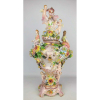 Grande potiche em faiança porcelanizada espanhola, policromado e profusamente decorado com puttinos, flores, damas e querubins em alto relevo, com restauro. Detalhes em dourado. Base solta. Alt. 52cm.