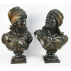 Wilhelm Giesecke (Altona 1854 - Barmen 1917) e assinatura ilegível - Dois bustos representando casal de árabes, com interior em argamassa de estuque cobertos com folhas de cobre pintado. Busto da figura masculina assinado Giesecke. Busto da figura feminina com assinatura ilegível. Artistas de cotação internacional e com vendas registradas em leilões no exterior. Alts. 58,5 e 56,5 cm.