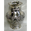 Belo vaso estilo D. João V, bojudo, em prata teor 835 milésimos, profusamente cinzelado em conchas, flores e volutas. Alt. 36cm.