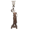 Mednat - Excepcional e imponente luminária, francesa em petit bronze e biscuit, na forma de figura feminina sustentando tocha. Artista catalogado no Berman. Alt. 95cm. 