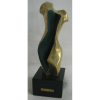 Vera Tores - Escultura em bronze dourado com detalhes em verde, - representando Dorso Feminino. Base em granito. Acompanha certificado. - Alt. total 37cm.