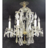 Lustre, estilo Versailles, para 6 luzes, em cristal, formado por 6 braços recurvos. Contas e pingentes em cristal bisotado. Alt. 63cm.