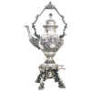 Samovar em prata brasileira, contrastada, teor 833 milésimos, cinzelada em flores, folhas, volutas e perolados. Pés em sapatas. Alt. 52,5cm. Peso 3.170kg.