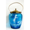 Mary Gregory - Biscoiteira em vidro na cor azul, com pintura na cor leitosa de menina no lago. Guarnições em metal dourado. ALt. 24cm. 