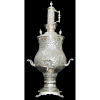 Grande Samovar Persa, Iran século XIX.Em metal espessurado a prata, cinzelado e burilado com em flores, folhas e volutas em baixo relevo. <br />Consta de inscrição no frontão. Alimentado a carvão.Alt. 84 cm.