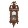 AMERICAN HAMBURG CLOCK COMPANY. ( GERMANY, 1874-1930) Mostrador esmaltado, numerais romanos. Relógio de parede. Acrescido de adorno e encimado por águia.<br />Medidas: 80X34X18 CM.