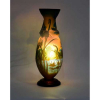 GALLÉ, <br />Floreiro de pasta de vidro<br />Alt. 31 x 12cm.<br />Galle Dragonfly Vase<br /><br />Um impressionante vaso de camafeu GALLE com desenho único de balaustrado abaixo do bocal onde de destacam libélulas voando sobre o lago aquático.<br />O design aquático Gallé de um lago com nenúfares é um dos designs mais procurados, mas o mesmo design com a atração adicional da dramática libélula em vôo torna-o um vaso verdadeiramente excitante.<br />O corpo transparente do vaso de banjo é preenchido internamente com um amarelo claro no pescoço e na base, enquanto as camadas externas de ametista sobre o vidro camafeu azul claro foram gravadas com ácido duas vezes para fornecer os detalhes do lago aquático e a impressionante libélula voadora.<br />A estratificação soberbamente precisa do vidro com azul em vidro transparente fornece um céu azul, enquanto o azul em amarelo fornece água de lagoa verde pálido.<br />O fundo é fosco para um acabamento acetinado, enquanto a camada externa de vidro camafeu é polida à mão para destacar os detalhes do design.<br />A assinatura muito fina e sutil escondida entre os nenúfares no lago.<br />Esse modelo tornou-se tão raro que suas replicas são vendidas, como replicas, com valores superiores a US$ 7.500<br /><br />SOBRE:<br />Não se pode evocar os anos de 1900, do Art Nouveau ou de Nancy sem evocar o nome de Gallé. <br />O Mestre Vidreiro Emile Gallé sempre quis que sua cidade natal fosse associada ao seu nome e à sua obra. Poucos anos antes de sua morte, lançou a Aliança Provincial das Indústrias de Arte, conhecida como Escola de Nancy de 1901). Objetivava reunir todos os artistas, artesãos e industriais.<br />A pasta de vidro é conhecida desde a antiguidade, mas nas mãos de Gallé, que tambem foi um industrial, a produção passou de mais de um milhão de vasos durante sua vida.<br />Gallé foi proprietário da empresa Emile Gallé com mais de 300 funcionários.<br />O processo de decoração do vidro foi patenteado em 26 de abril de 1898 a foiapresentado no Salon du Champ de Mars em Paris no mesmo ano.<br />De 1894 a 1904, suas assinaturas em vidro são, na maioria das vezes, assinadas sem o primeiro nome do artista, gravados em camafeu ou em uma cavidade, com um único ou duplo curso. <br />Após sua morte até 1914, sua esposa decidiu usar a mesma assinatura para todas as produções, independentemente do cenário. A assinatura continuou de 1914 a 1936 pelos sucessores: Paul Perdrizet, Claude Gallé e Emile Lang. O nome da empresa passou à: Maison Gallé e depois Société anonyme des Etablissements Gallé. A produção de peças durante a 1ª Guerra Mundial é estimada em 30.000 exemplares.<br />Entre 1896 e 1931 estima-se em 1 milhão a produção de peças “Gallé”<br />Em 8 de maio de 1954 foi inaugurado Musée de l'Ecole de Nancy.<br />Hoje é, senão o maior nome do Art Nouveau, O maior vidreiro dos anos 1900.<br /><br />Todas as obras estrangeiras são vendidas como atribuidas.