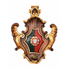 Florão Heráldico- Brasão de Armas Real Português.<br />Espessa madeira entalhada, policromada e com folha de ouro ao gosto Barroco.<br />Atribuído ao Século XIX. <br />MEDIDAS: 76 x 62 X 8 cm. Peso:6,900 kg