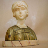 A. TRÉFOLONI (ITALY, 1890 - 1930)<br /><br />BRONZE, MARMORE CARRARA, BASE MÁRMORE RAJADO.<br />BUSTO DE MULHER, ART NOUVEAU <br /><br />20x17x9 cm.<br /><br />https://www.mutualart.com/Artist/A--Trefoloni/8D9DA478D5536D65