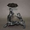 WMF - GERMANY (Württembergische Metallwarenfabrik)- Art Nouveau (1890-1910)<br />PALITEIRO EM SILVERPLATED PIERROT COM GUARDA CHUVA E CÃO<br />14,5X13X7,5 cm.<br />