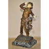 Clement ROUSSEAU (1872-1950)<br />BRONZE E MARFIM PATISSIER<br />Bronze maciço com resquício de douração<br />32x16x12 cm., <br />Sobre base mámore verde.<br />três outras esculturas do mesmo autor reproduzidas fotograficamente no livro ART DECO, BRYAN CATLEY, página 285.<br />