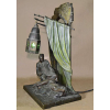 Bruno ZACH (1891 – 1945)<br />BRONZE AUSTRIACO, Grupo escultórico tenda com luminária<br />ARGENTOR- VIENNA.<br />38x22x17 cm.<br />BIOGRAFIA: escultor austríaco nascido na Ucrânia, mais conhecido por sua escultura Art Déco em bronze e marfim. Uma figura pioneira e controversa da era Art Nouveau, ele sempre focou em temas eróticos. As estatuetas elegantes de Zach freqüentemente representavam dominatrixes, como em seu icônico The Riding Crop , uma escultura de bronze de uma mulher em liga e salto segurando o chicote nas costas. Ele também esculpia cenas explícitas de felação e relações sexuais, ao mesmo tempo em que buscava temas de gênero mais tradicionais, como dançarinos, criaturas mitológicas ou cavaleiros. Nascido em 6 de maio de 1891 em Zhytomyr, Ucrânia, o artista passou a estudar com Hans Bitterlich e Josef Mullnerna Academia de Belas Artes de Viena. Zach supostamente passou grande parte de sua vida em Berlim e Viena farreando com prostitutas e em boates, onde encontrou amantes e modelos para suas esculturas provocantes. Zach morreu aos 53 anos em 20 de fevereiro de 1945 em Viena, Áustria. Hoje, suas obras estão na coleção do Museu Art Déco de Moscou.<br />