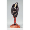 ROLAND – PARIS Escultura de bronze patinado com marfim representando figura de Mephisto phesles medindo 26 cm. de altura, peça art decor reproduzida em vários livros.
