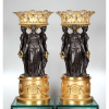 Imponente par de floreiros de bronze dourado e patinado, constituído por três figuras femininas sobre base circular e encimadas pelo cachepot. 87 cm de altura. França, séc. XIX.