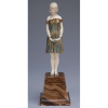 CHIPARUS, Demetre<br />Innocense. Escultura de bronze e marfim sobre base de mármore. Assinada na base.25 cm de altura. <br />França, c. 1935. Reproduzida em Master of Art Deco, de Alberto Shayo, na pág. 83.
