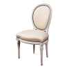 Raro conjunto de 18 cadeiras de inspiração Louis XVI, provavelmente fabricação Casa Jansen, <br />madeira patinada de bege claro, encosto balão e assento estofados e revestidos de tecido. <br />96 cm de altura, o espaldar. Brasil, séc. XX.