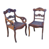 Magnífico conjunto de 10 cadeiras e duas poltronas de jacarandá, estilo império. <br />Assento de palhinha. 94 cm de altura. Brasil, séc. XIX.