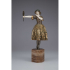 CHIPARUS, Demetre - Indiscreet. Escultura de bronze patinado - e dourado, mãos e rosto de marfim, sobre base - de ônix. Assinada na base. 44 cm de altura. - França, c. 1930.