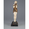 CHIPARUS, Demetre (1888-1947)<br>The Little Sad One. <br>Escultura de bronze e marfim sobre base de mármore. <br>30,5 cm de altura. <br>Assinada e com a marca da fundição Ettling<br> Paris, na base.<br><br>Reproduzido em Master of Art Deco, de Alberto Shayo, à pág. 76; em Art Deco ant Other Figures, de Bryan Catley, à pág. 71. e em Art Deco Sculpture, de Victor Arwas, à pág. 39.
