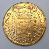 Moeda de Ouro, Brasil - 20.000 Réis, 1724 MMMM (Dobrão). A data mais rara da série dos Dobrões que foram cunhados em Minas Gerais nos anos de 1724, 1725, 1726 e 1727. Era a moedas de ouro mais pesada em circulação na sua época e representava a riqueza da exploração do ouro em Minas Gerais. Moedas em excepcional estado de conservação