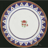 Bispo de Mariana. Prato de porcelana Cia-das-Índias, aba com elementos repetitivos triangulares em azul e branco, formando denteado, na caldeira buquê de flores, pertencente a Dom Cipriano de São José; 24,5 cm de diâmetro. China, séc. XVIII. Reproduzido à página 364 do livro O Brasil e a Cerâmica Antiga, por Eldino Brancante. Origem: ex-coleção Maria Helena e Eldino F. Brancante. Apresenta dois pequenos bicados na borda. 